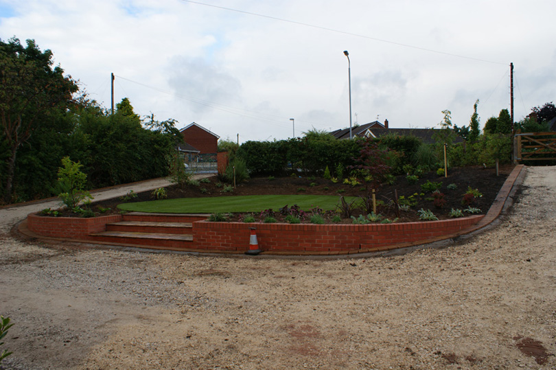 The front lawn is laid and the borders planted.